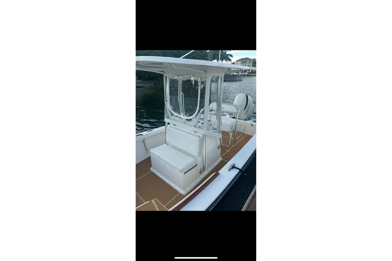 Slide: The Image of 2019 Albury Brothers 23 Forward Seating boat docked by the water. - 7