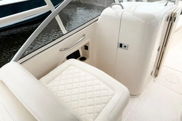 Slide: The Image of 2023 Grady-White Freedom 255 boat interior with quilted seating and sleek design. - 16