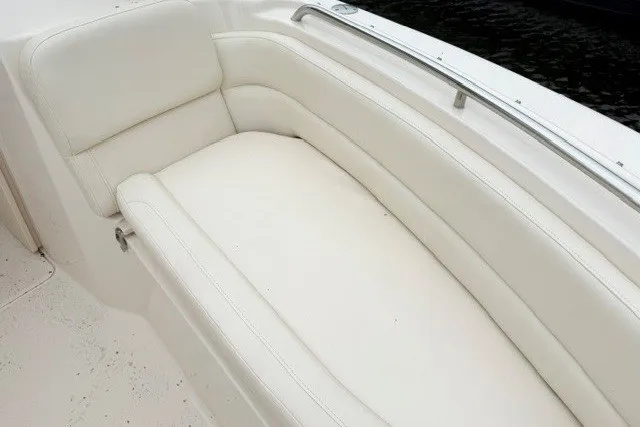 Slide: The Image of Luxurious seating on 2023 Grady-White Freedom 255 boat, featuring white cushioned upholstery. - 23