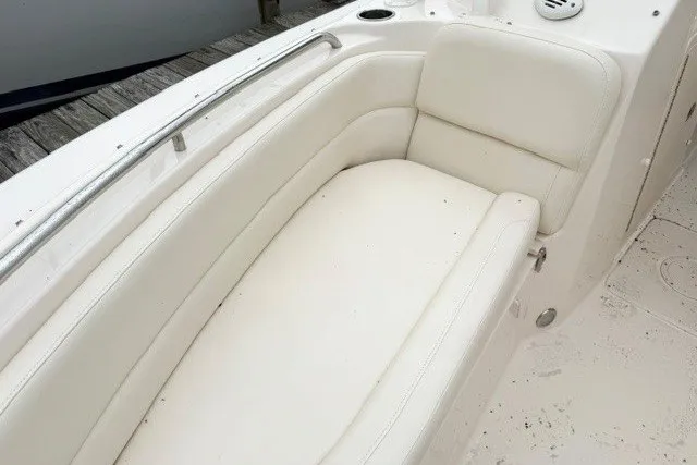 Slide: The Image of 2023 Grady-White Freedom 255 boat with white cushioned seating. - 22