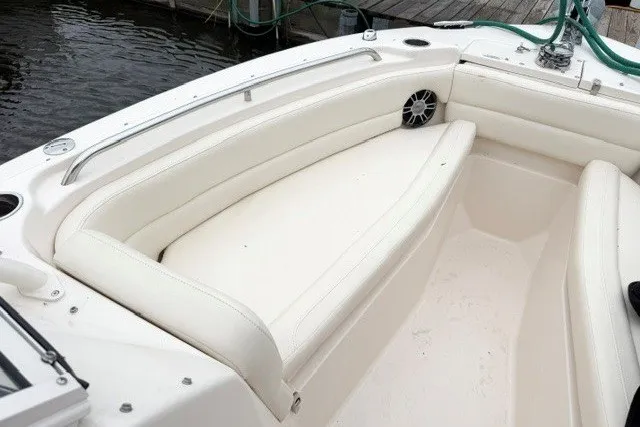 Slide: The Image of 2023 Grady-White Freedom 255 boat interior with white cushioned seating. - 24
