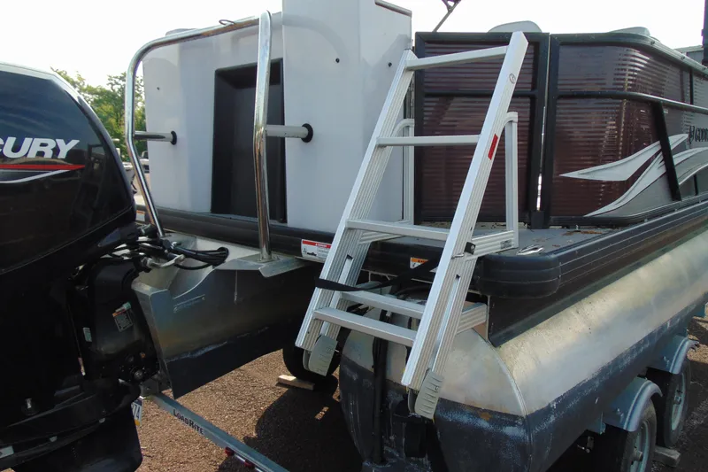 Slide: The Image of 2022 Godfrey Sweetwater 2186 FS pontoon boat with Mercury outboard motor and boarding ladder. - 5