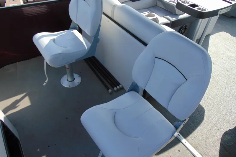 Slide: The Image of 2022 Godfrey Sweetwater 2186 FS boat interior with two white swivel seats. - 17