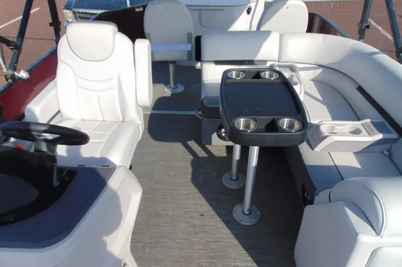 Slide: The Image of Interior of 2022 Godfrey Sweetwater 2186 FS pontoon boat with white seating and table. - 8
