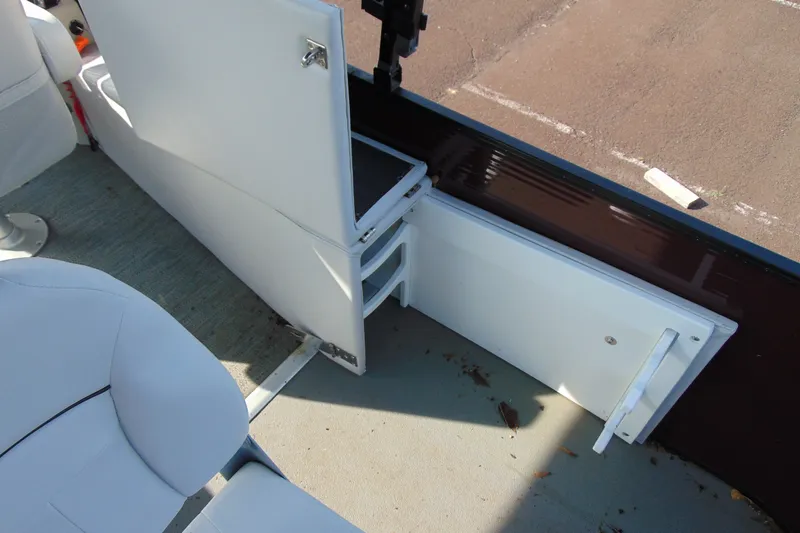Slide: The Image of Open storage compartment on 2022 Godfrey Sweetwater 2186 FS boat interior. - 16
