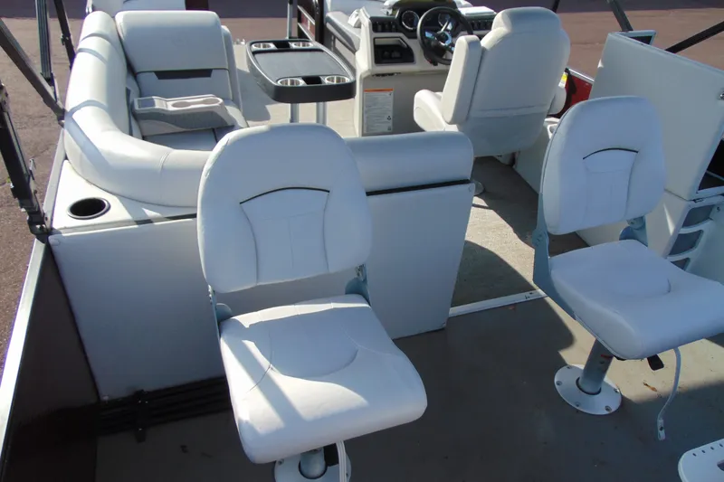 Slide: The Image of Interior of 2022 Godfrey Sweetwater 2186 FS boat with white seating and steering console. - 22