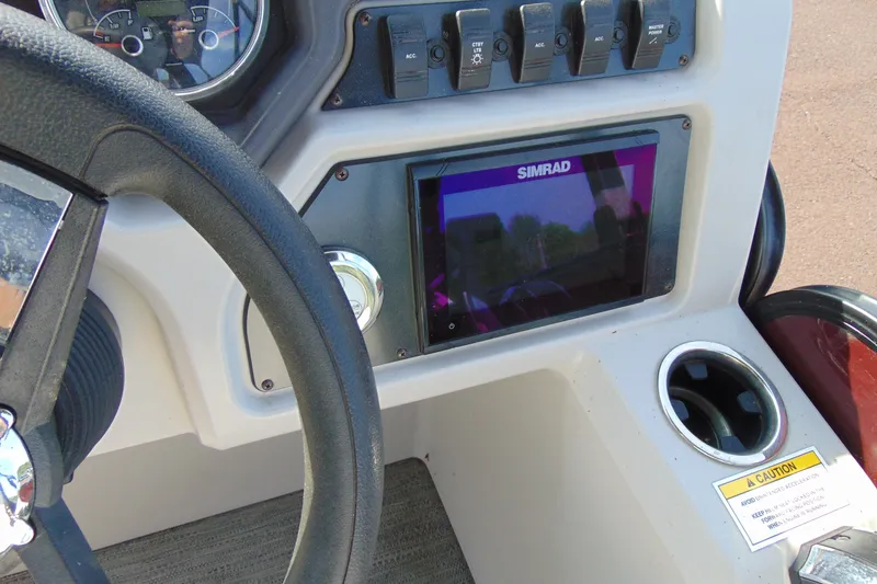 Slide: The Image of Dashboard of 2022 Godfrey Sweetwater 2186 FS with Simrad display and controls. - 13