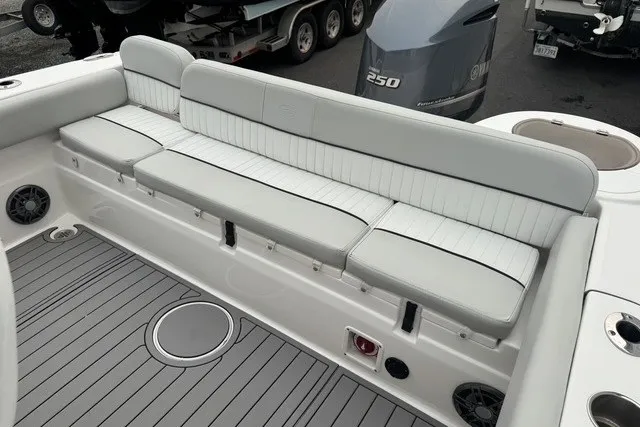 Slide: The Image of 2022 Sea Fox 249 Avenger boat interior with cushioned seating and Yamaha 250 engine. - 25