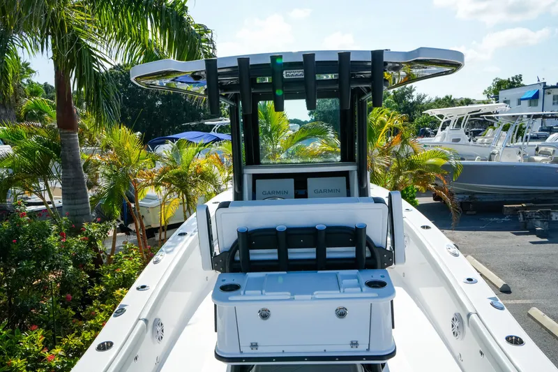 Slide: The Image of 2027 Blackfin 262 HB boat with advanced Garmin navigation, surrounded by tropical greenery. - 12