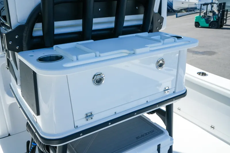 Slide: The Image of 2027 Blackfin 262 HB boat console with cup holders and storage compartment. - 14