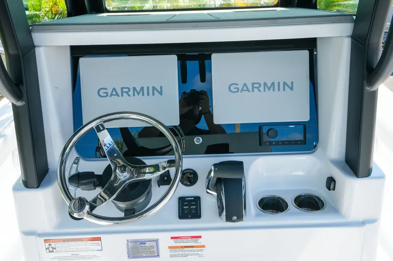 Slide: The Image of 2027 Blackfin 262 HB helm with dual Garmin displays and steering wheel. - 17