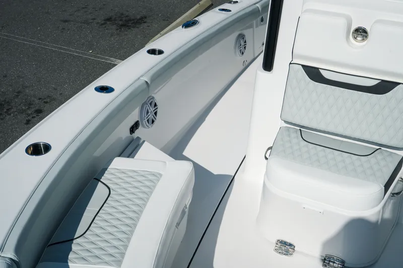 Slide: The Image of Interior of 2027 Blackfin 262 HB boat with cushioned seating and cup holders. - 25