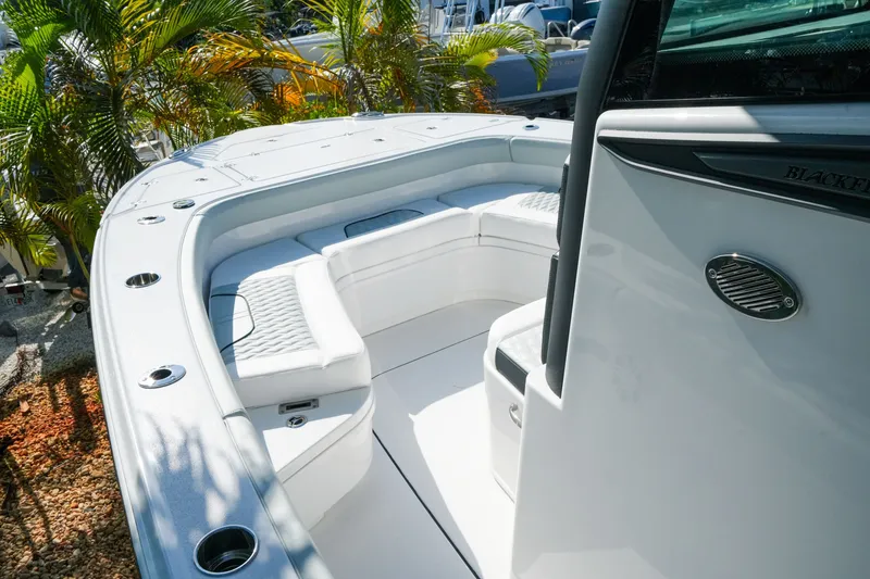 Slide: The Image of 2027 Blackfin 262 HB boat interior with white seating and sleek design. - 20