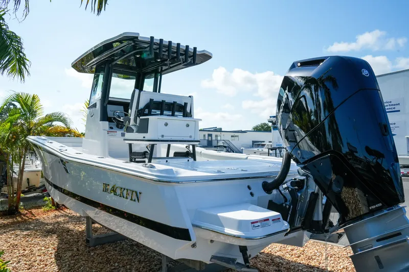 Slide: The Image of 2027 Blackfin 262 HB boat with powerful outboard motor, displayed outdoors under clear skies. - 5