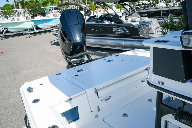 Slide: The Image of 2027 Blackfin 262 HB boat with sleek design and powerful outboard motor. - 28