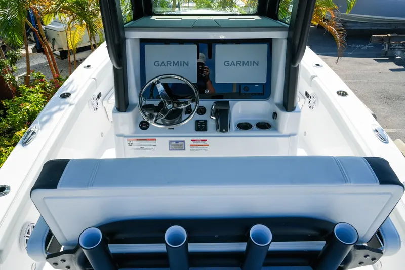 Slide: The Image of 2027 Blackfin 262 HB boat cockpit with Garmin displays and steering wheel. - 16