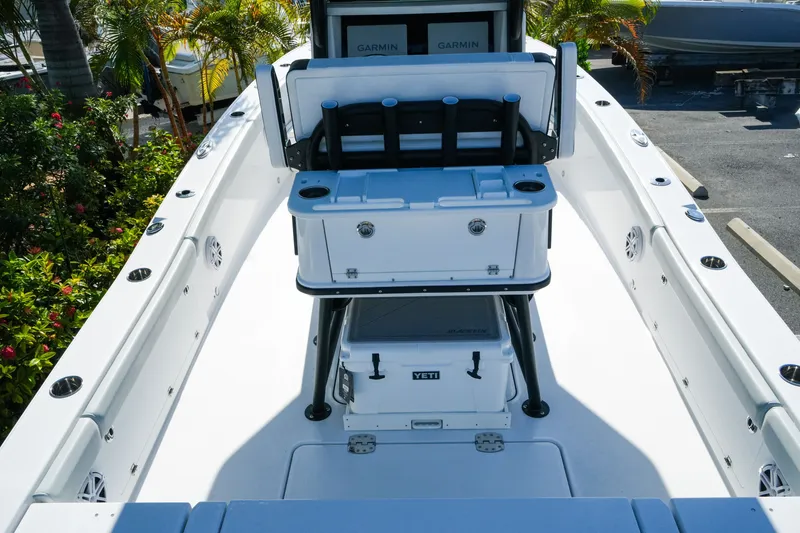 Slide: The Image of 2027 Blackfin 262 HB boat interior with seating, cooler, and Garmin electronics. - 10