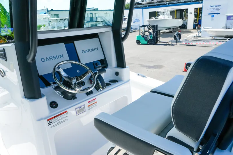 Slide: The Image of Interior view of 2027 Blackfin 262 HB boat with Garmin navigation system. - 19