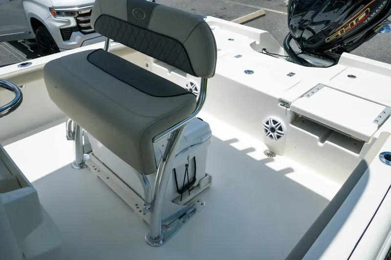 Slide: The Image of Interior of 2027 Key West 230 Bay Reef boat with seating and motor details. - 28