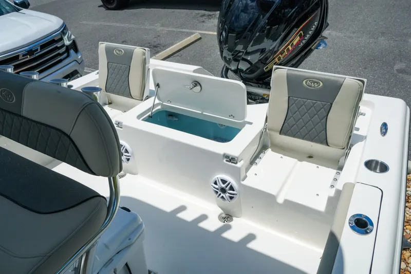 Slide: The Image of 2027 Key West 230 Bay Reef boat interior with seating and storage compartments. - 31