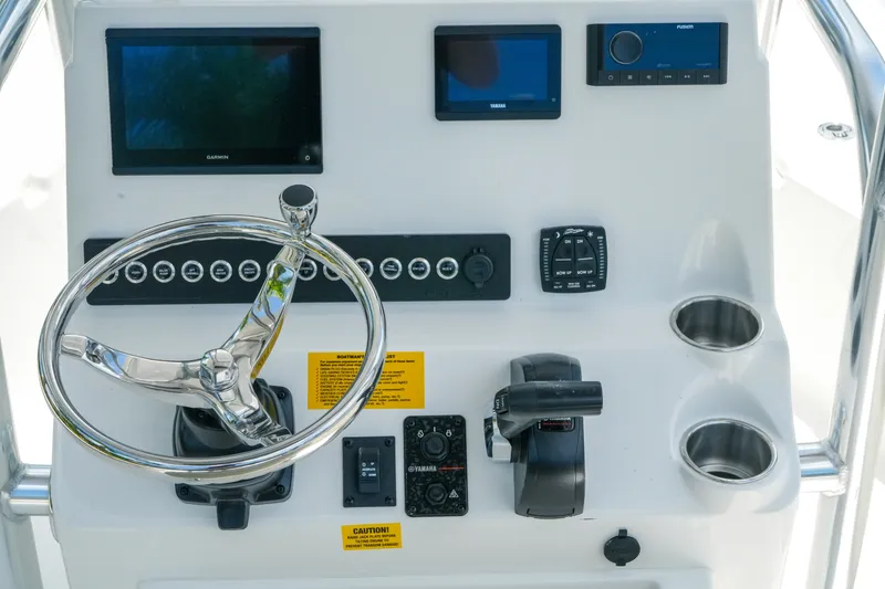 Slide: The Image of Steering console of 2027 Key West 230 Bay Reef boat with modern controls and displays. - 15