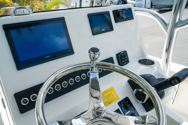 Slide: The Image of Steering console of 2027 Key West 230 Bay Reef boat with modern navigation displays. - 16