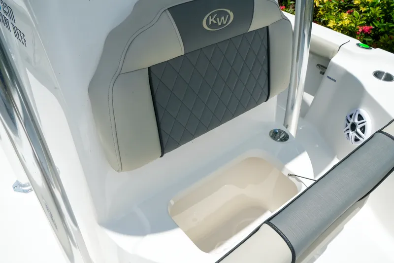 Slide: The Image of 2027 Key West 230 Bay Reef boat seat with diamond-patterned upholstery and speaker. - 25