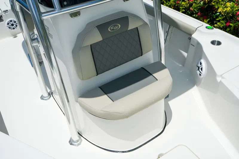Slide: The Image of 2027 Key West 230 Bay Reef boat seat with gray and beige upholstery. - 24
