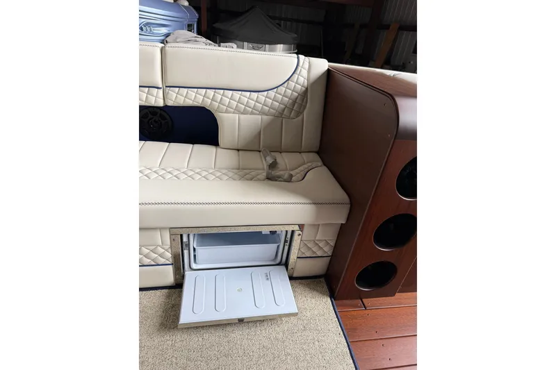 Slide: The Image of Luxurious seating with built-in cooler on 2025 StanCraft 260 Day Boat. - 20