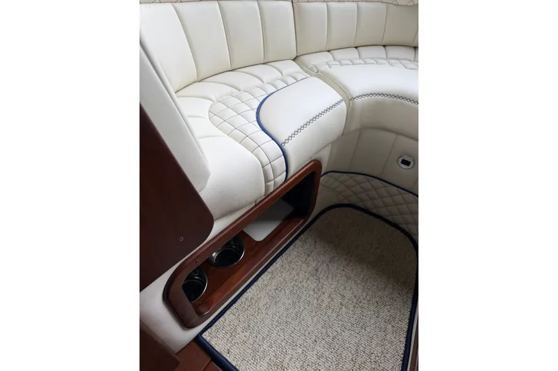 Slide: The Image of Luxurious interior of 2025 StanCraft 260 Day Boat with elegant seating and carpeted flooring. - 14