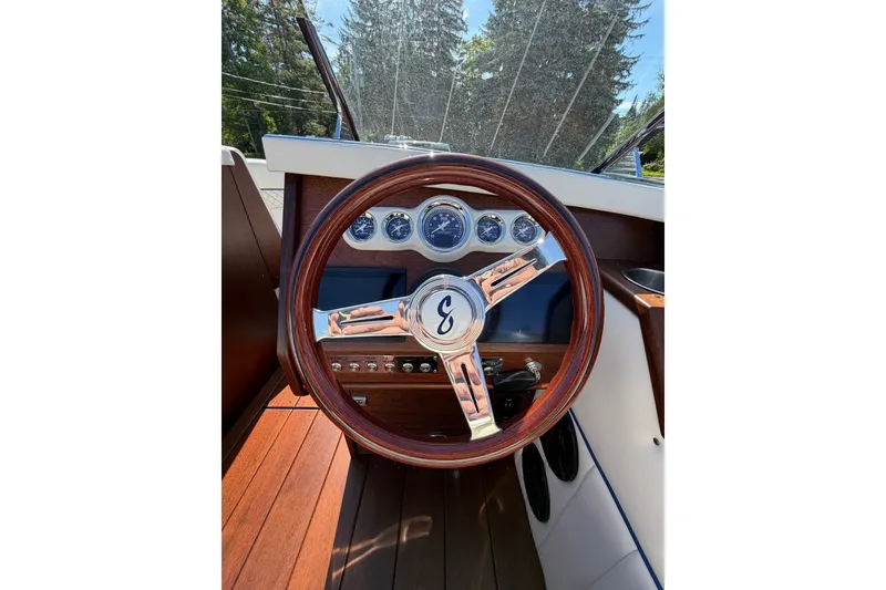 Slide: The Image of Steering wheel of 2025 StanCraft 260 Day Boat with classic wooden finish. - 35