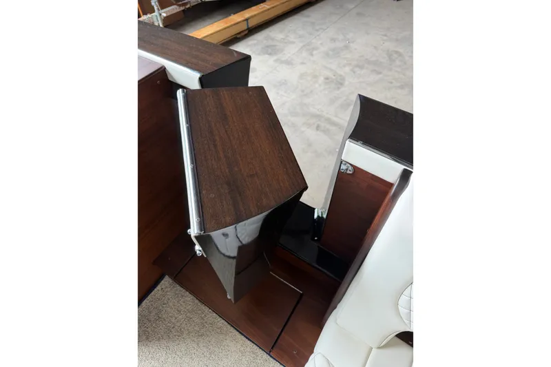 Slide: The Image of Interior detail of 2025 StanCraft 260 Day Boat, featuring elegant wood finish and modern design. - 19