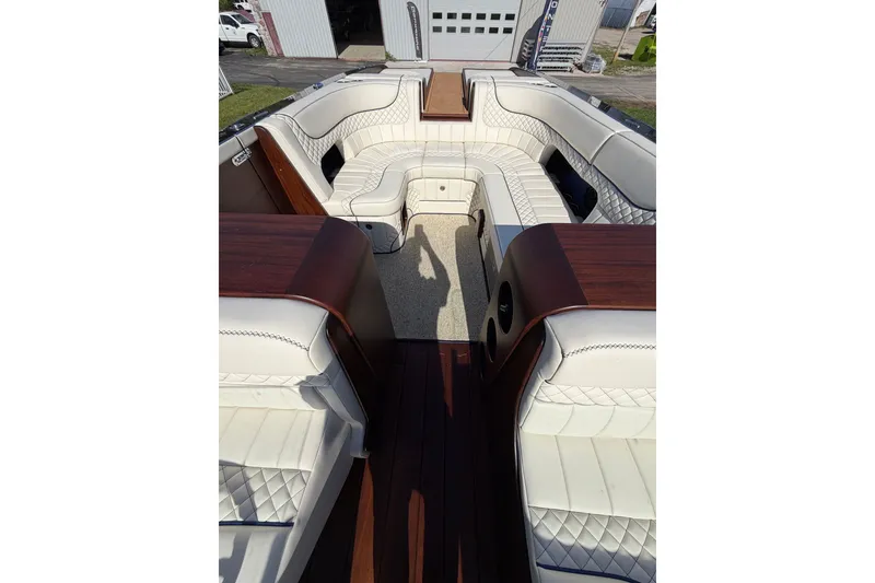 Slide: The Image of Luxurious interior of 2025 StanCraft 260 Day Boat with elegant white seating and wood accents. - 41