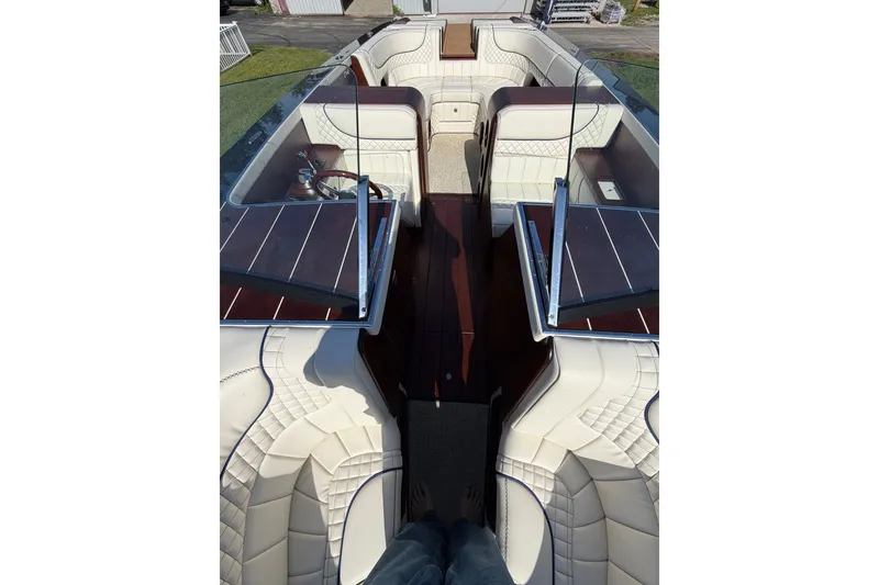Slide: The Image of 2025 StanCraft 260 Day Boat interior with luxurious white seating and wooden accents. - 42