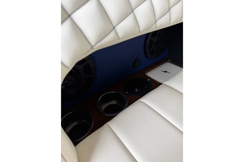 Slide: The Image of Interior of 2025 StanCraft 260 Day Boat with white quilted seating and cup holders. - 22