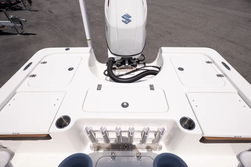 Slide: The Image of 2027 Sea Pro 210 Bay boat with Suzuki outboard motor, featuring spacious deck layout. - 15