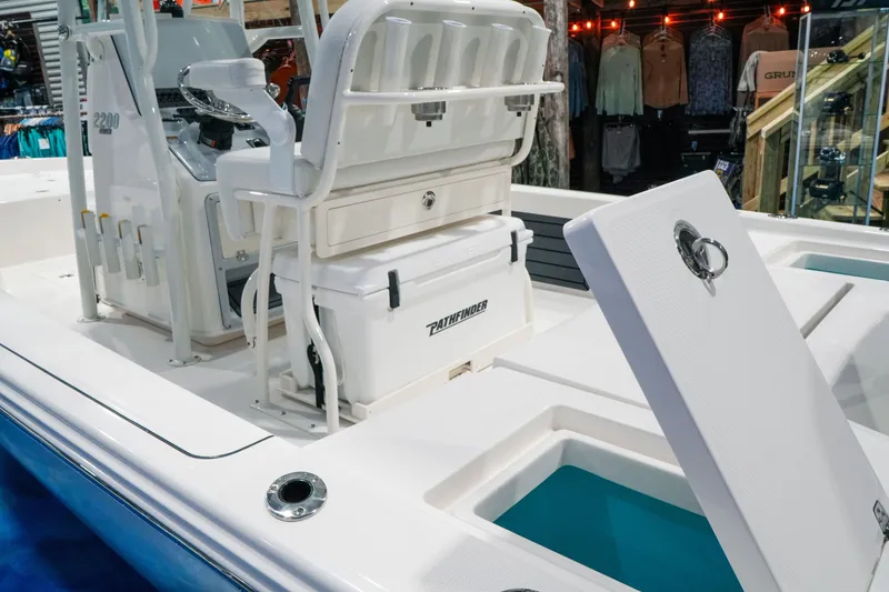 Slide: The Image of 2027 Pathfinder 2200 Hybrid boat interior with seating and storage compartments. - 14