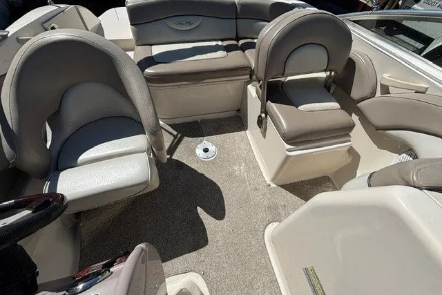Slide: The Image of Interior of a 2004 Sea Ray 200 Sundeck boat with cushioned seating. - 8