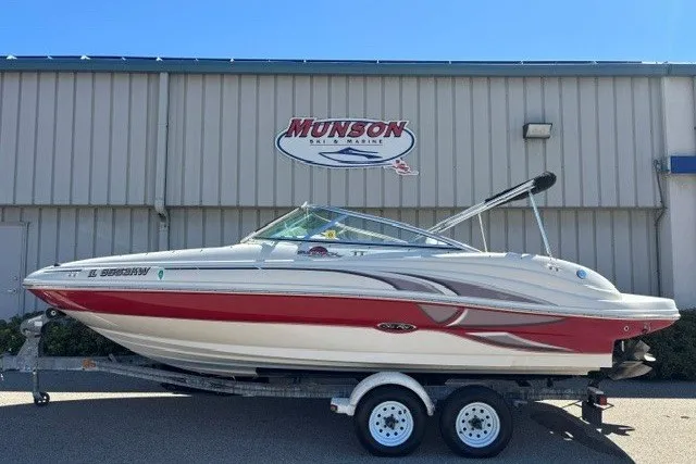 Slide: The Image of 2004 Sea Ray 200 Sundeck boat on trailer, parked outside Munson Ski & Marine building. - 19