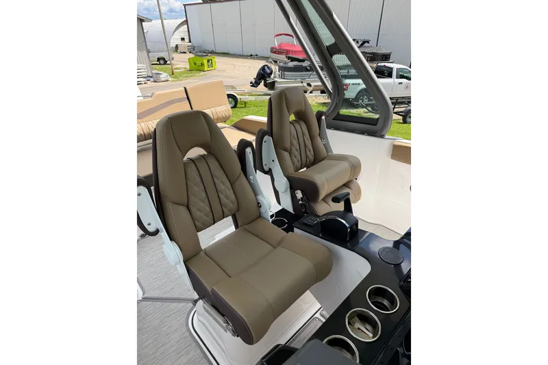 Slide: The Image of Luxurious seating in the 2027 Monterey Elite 25 OB boat, featuring premium brown upholstery. - 14