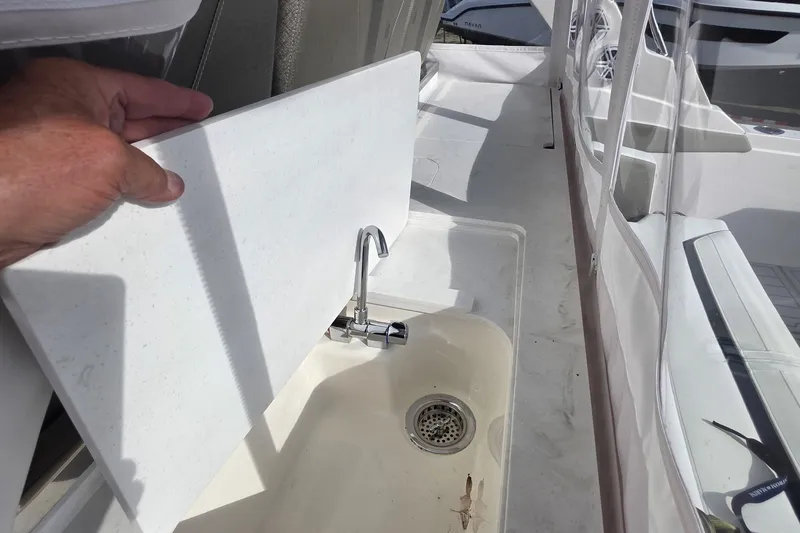 Slide: The Image of 2024 Tiara Sport 34LS boat sink with cover, showcasing sleek design and functionality. - 27
