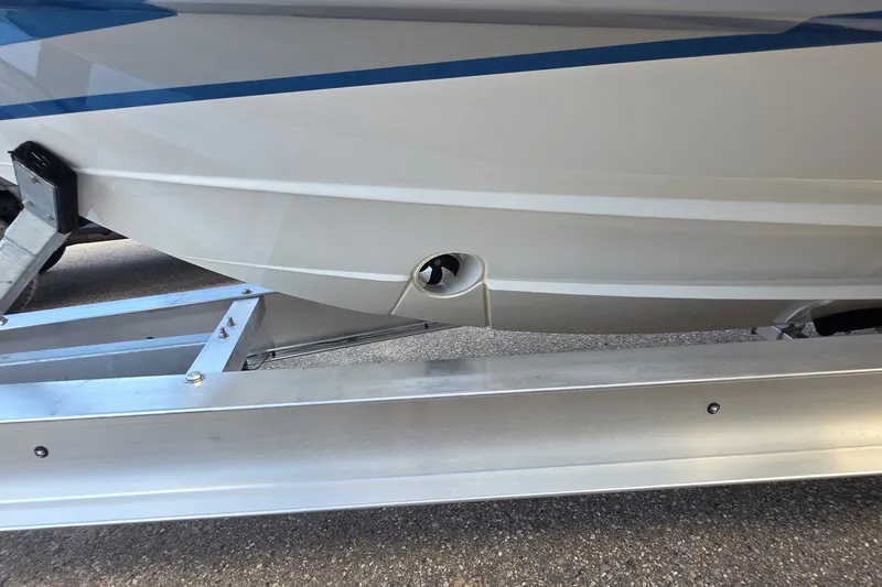 Slide: The Image of 2024 Tiara Sport 34LS boat hull on trailer, showcasing sleek design and craftsmanship. - 33