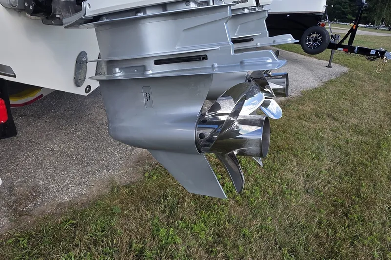 Slide: The Image of 2024 Tiara Sport 34LS boat propeller detail on grassy surface. - 40