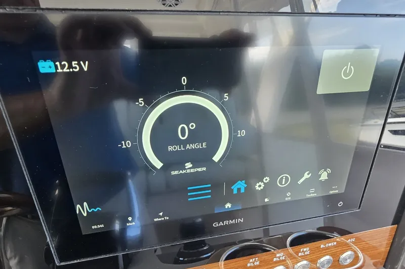 Slide: The Image of Garmin display on 2024 Tiara Sport 34LS showing Seakeeper roll angle at 0 degrees. - 25