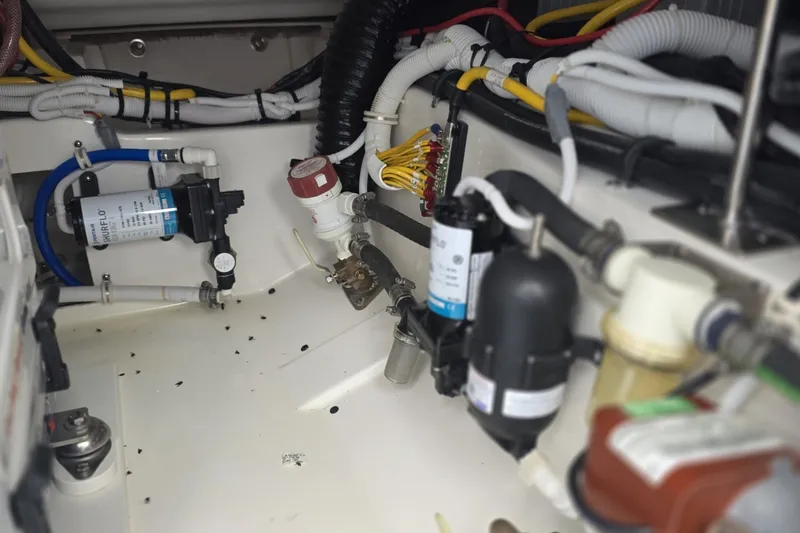 Slide: The Image of 2024 Tiara Sport 34LS boat engine compartment with wiring and components. - 39