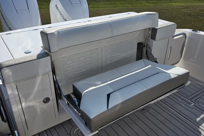 Slide: The Image of 2024 Tiara Sport 34LS boat with foldable seating and Mercury engines. - 13