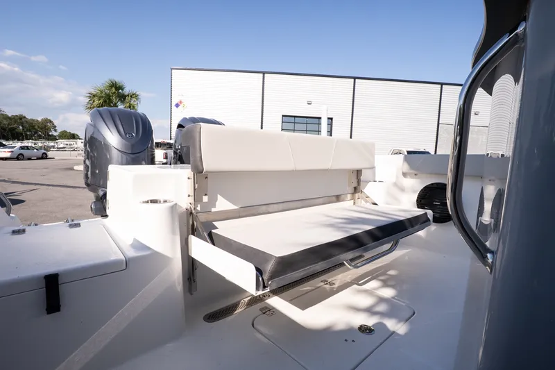 Slide: The Image of 2027 Sea Pro 262 Offshore boat with foldable seating and dual outboard motors. - 18