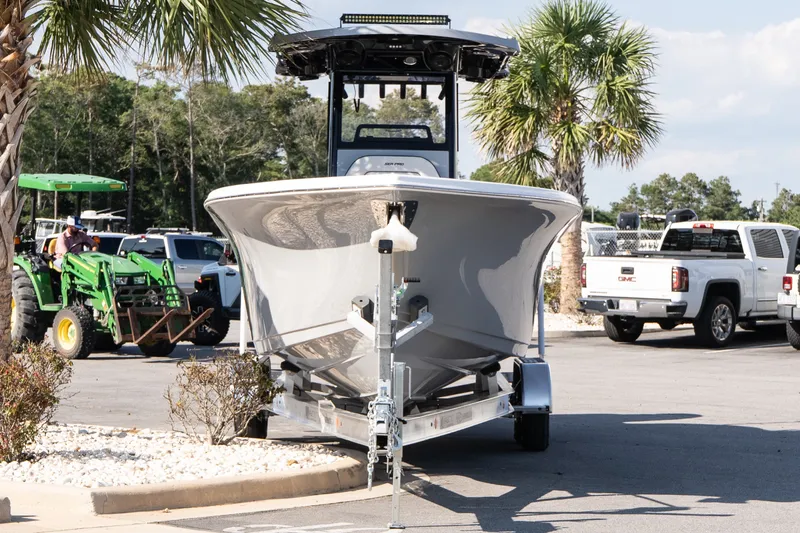 Slide: The Image of 2027 Sea Pro 262 Offshore boat on trailer in parking lot with palm trees. - 3