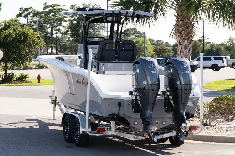 Slide: The Image of 2027 Sea Pro 262 Offshore boat with dual Yamaha engines on a trailer. - 4