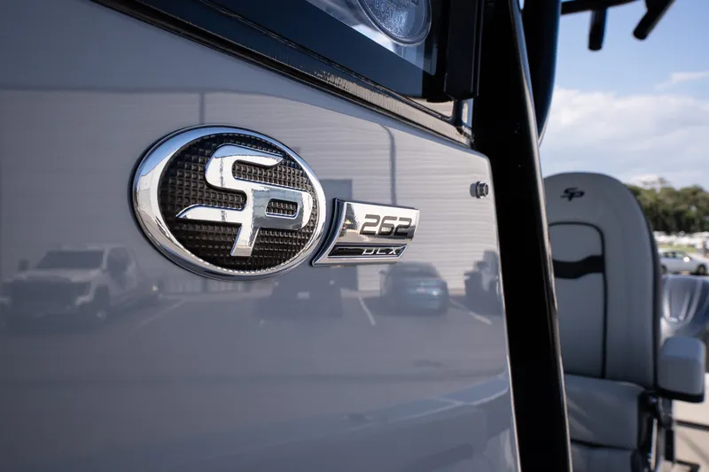 Slide: The Image of Close-up of 2027 Sea Pro 262 Offshore boat emblem and seating. - 14